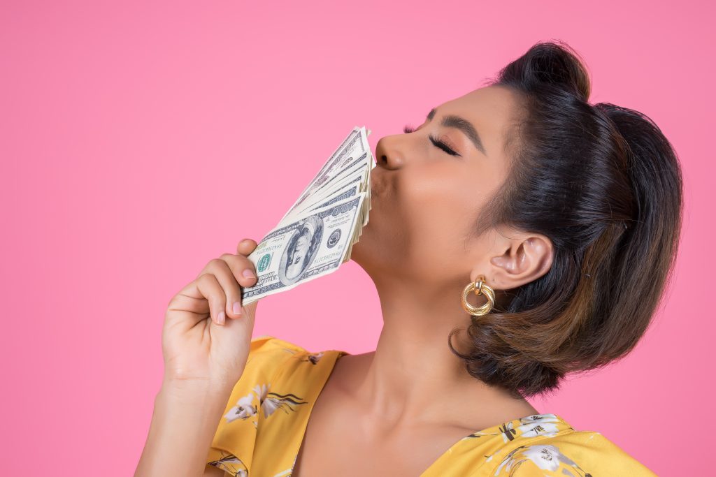 happy fashion beautiful woman hand holding dollar money